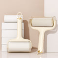 Load image into Gallery viewer, Sticky hair roller with beige handle and replacement paper rolls stacked
