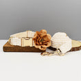 Load image into Gallery viewer, Dog collar and leash set displayed on wood slice with flower decoration
