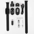 Load image into Gallery viewer, Unassembled camera components laid out with two black collars and USB cables
