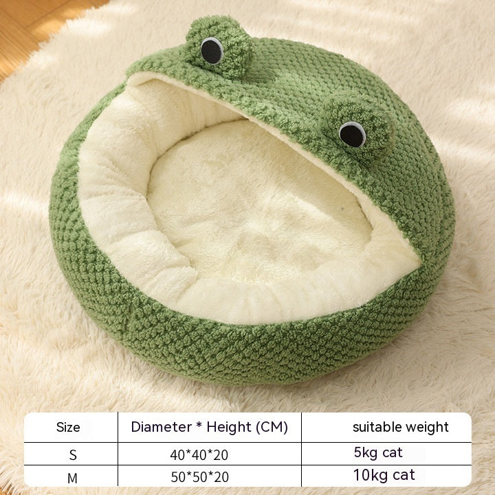 Open frog-shaped pet bed with plush cream interior and size chart, displayed on floor without pet