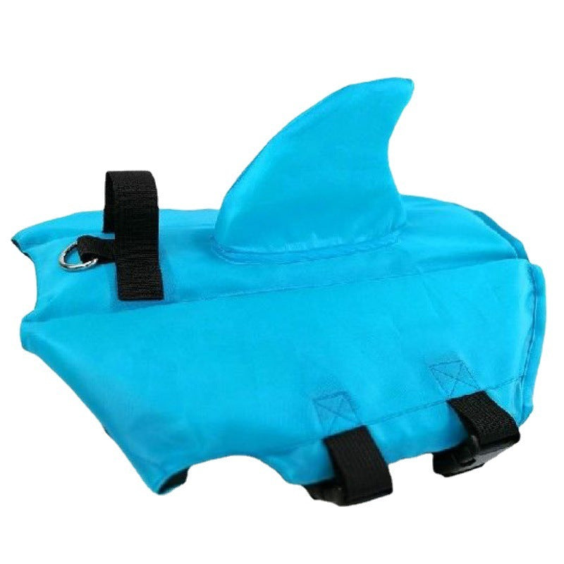Light blue shark fin dog life jacket with black adjustable strap and D-ring attachment
