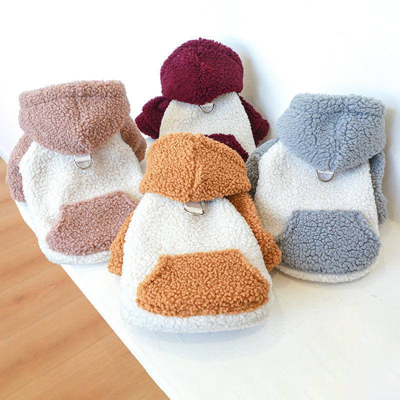 Four lamb fleece dog sweaters in beige, burnt orange, grey, and deep red colors displayed on a white surface