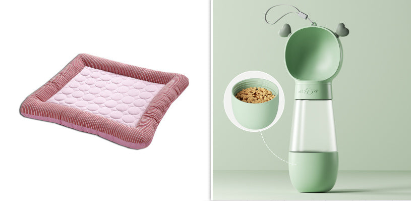 Pink cooling pet bed mat with gray striped cushions beside green pet feeder with heart handles and food bowl.