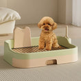 Cargar la imagen en la vista de la galería, Small fluffy brown dog sitting on the metal grate of light green and peach indoor potty training tray

