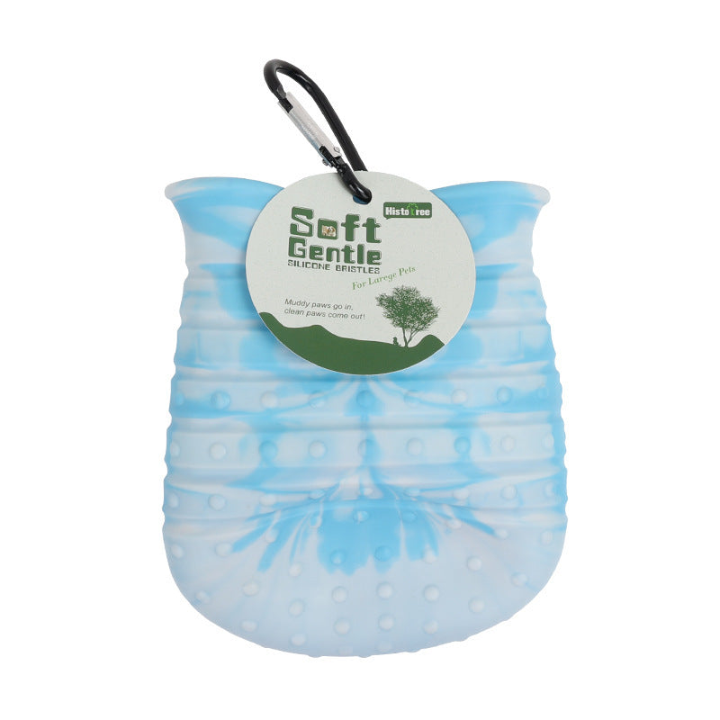 Blue silicone paw cleaner cup with hang tag labeled Soft Gentle
