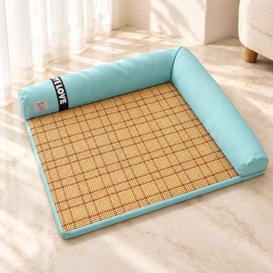 Green four corners woven-look pet mat with two adjacent padded bolsters on cream marble
