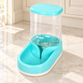 Charger l'image dans la visionneuse de la galerie, Green gravity pet water dispenser with clear reservoir and white base on pale marble
