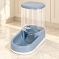 Charger l'image dans la visionneuse de la galerie, Grey gravity pet food dispenser with clear reservoir and white base on pale marble
