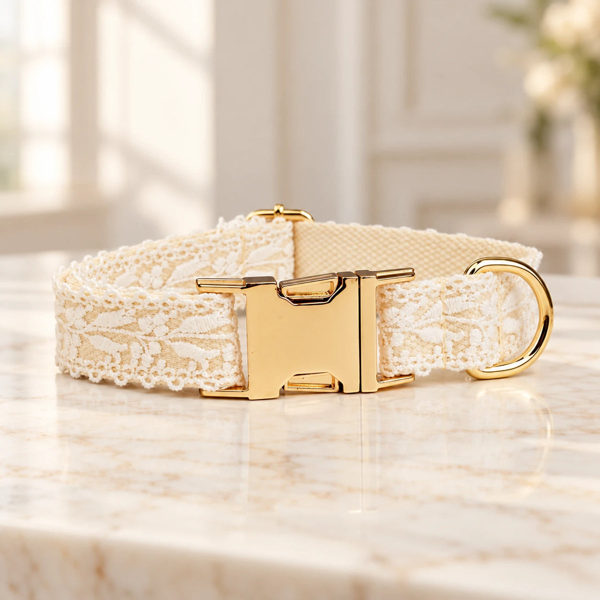 Cream leaf-lace dog collar with gold buckle and D-ring on ivory marble