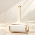 Load image into Gallery viewer, Pale-yellow lint roller with clear cover on ivory marble

