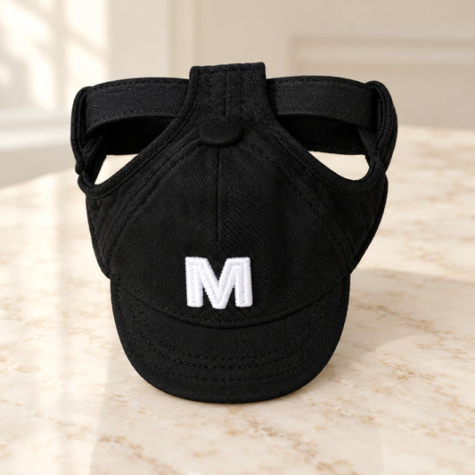Black pet baseball cap with white M embroidery and black adjustable strap