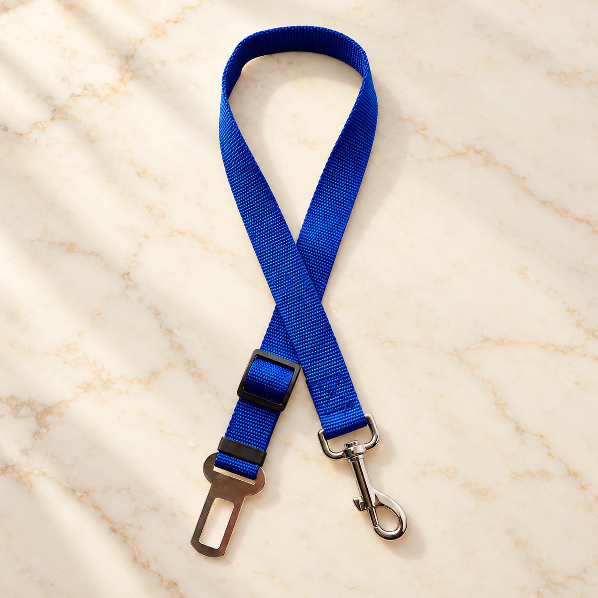 Blue adjustable pet car tether with metal seatbelt clip and swivel snap hook