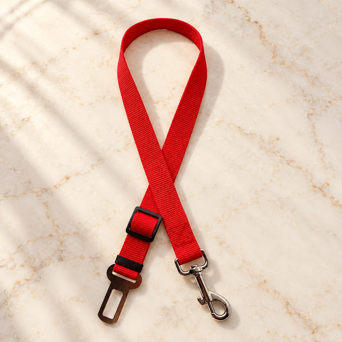 Red adjustable pet car tether with metal seatbelt clip and swivel snap hook