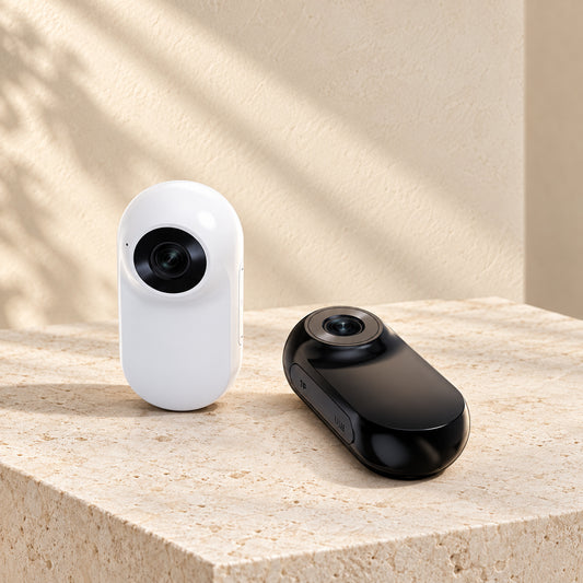 Black and white pet collar cameras showing the two available camera colours