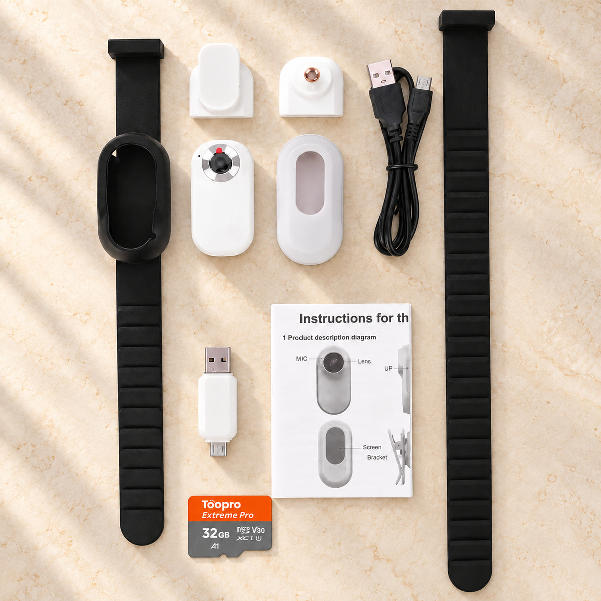 White pet camera collar kit with black straps, accessories and 32GB memory card