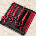 Load image into Gallery viewer, Red pet grooming set with four scissors, comb and forceps in an open black zip case
