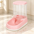 Charger l'image dans la visionneuse de la galerie, Pink gravity pet food dispenser with clear reservoir and white base on pale marble
