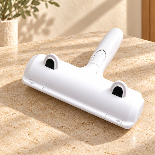 White reusable pet hair remover roller on a stone surface