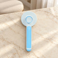 Charger l'image dans la visionneuse de la galerie, Blue round-head pet grooming brush showing rear release button on beige marble
