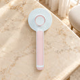 Charger l'image dans la visionneuse de la galerie, Pink round-head pet grooming brush showing rear release button on beige marble
