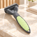 Cargar la imagen en la vista de la galería, Grey pet grooming comb with pale green grip and stainless steel teeth
