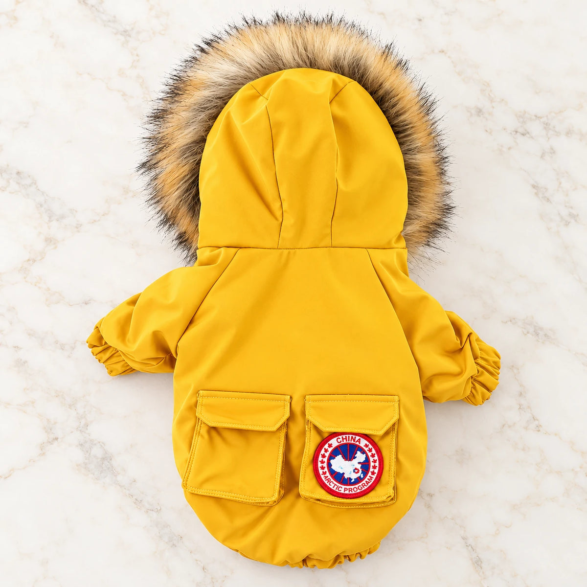 Hooded Puffer Dog Coat on pale ivory marble — yellow