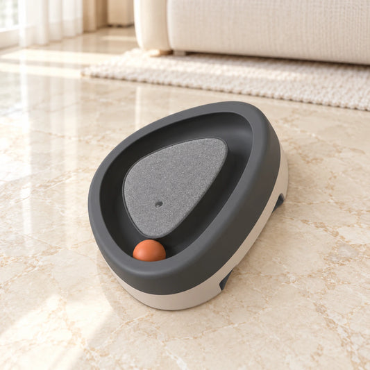 Grey triangle cat track toy with orange ball on beige marble